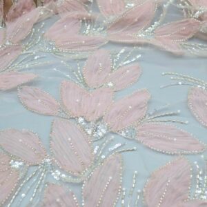 Close-up of Rosalie Blush Pink polyester fabric adorned with shimmering pink and silver sequins