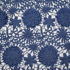 Close-up of blue polyester lace fabric featuring floral embroidery details