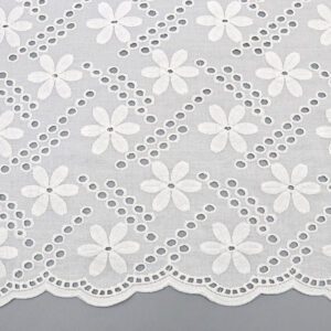 White cotton lace fabric adorned with delicate white flowers, showcasing intricate floral patterns