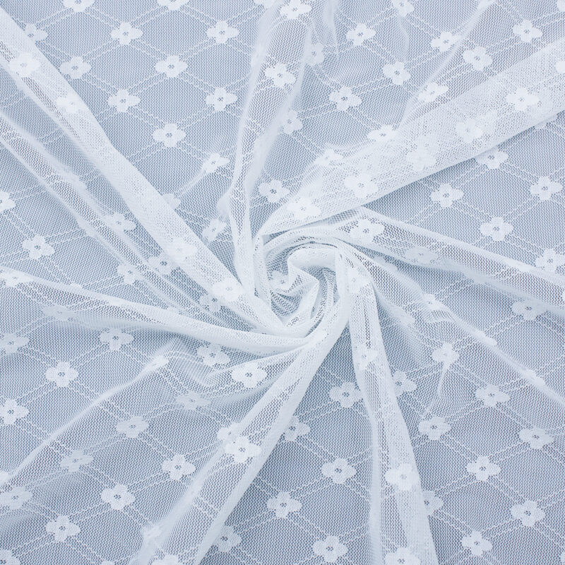 Close-up of white and gray patterned nylon and spandex lace fabric, showcasing intricate designs and textures