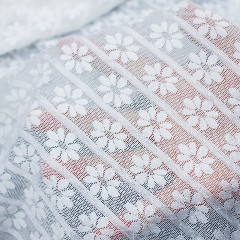 Floral-patterned white lace fabric composed of nylon and spandex materials