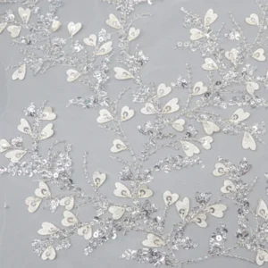 Silver sequin polyester lace fabric featuring intricate white flowers and leaves design