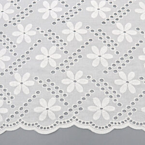 White cotton lace fabric adorned with delicate white flowers, showcasing intricate floral patterns