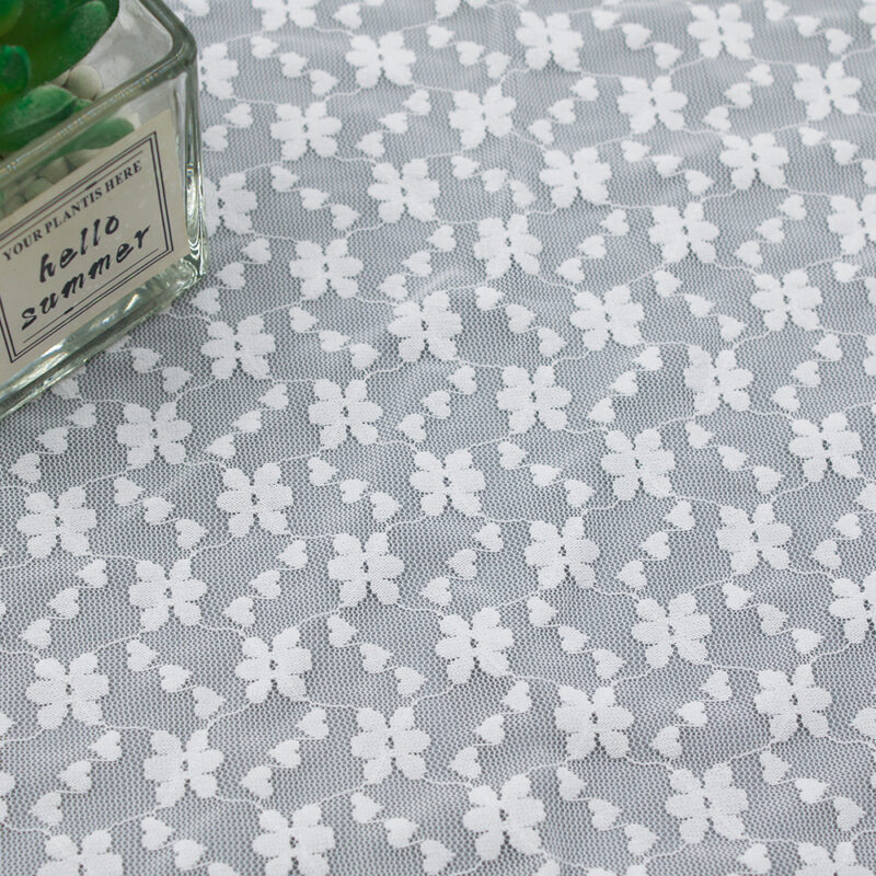 White lace fabrics featuring a butterfly design, made from nylon and spandex for added stretch and elegance