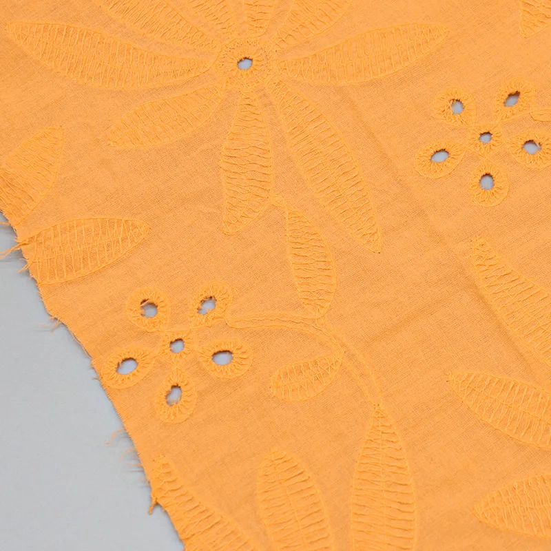 Manufacturer Wholesale Orange Customsized Color Jacquard White Fabric Eyelet Embroidered Fabric for Dress